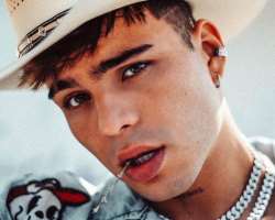 He has piercings in both of his ears.